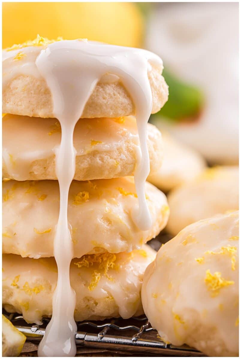 Stack of lemon ricotta cookies with lemon glaze dripping down the sides
