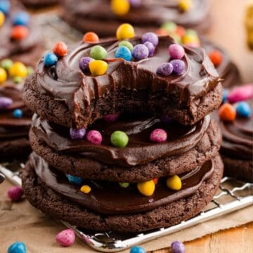 Cosmic Brownies Cookies stacked with chocolate ganache and rainbow candy coated chips