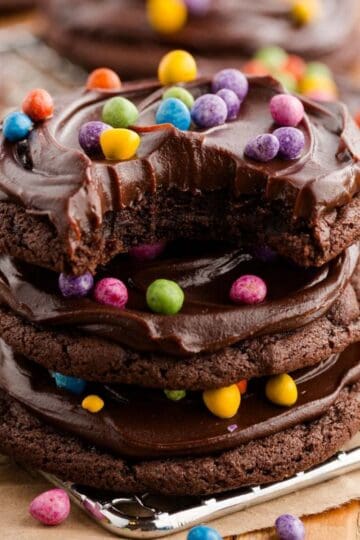 Cosmic Brownies Cookies stacked with chocolate ganache and rainbow candy coated chips